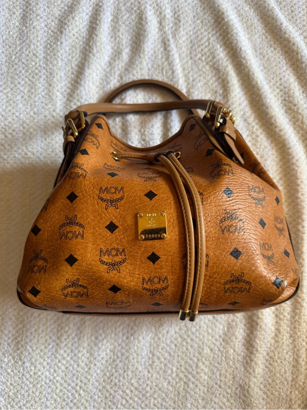 MCM Cognac Visetos Drawstring Bucket Bag with Gold Hardware